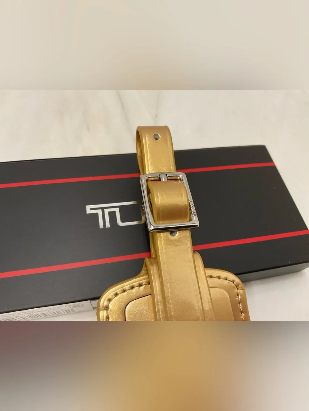 NEW Tumi 3.625” x 2.25” Leather Luggage Name Tag w/ Buckle - METALLIC GOLD